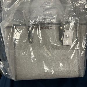 Brand new, still in packaging.  Kate Spade apple tote.